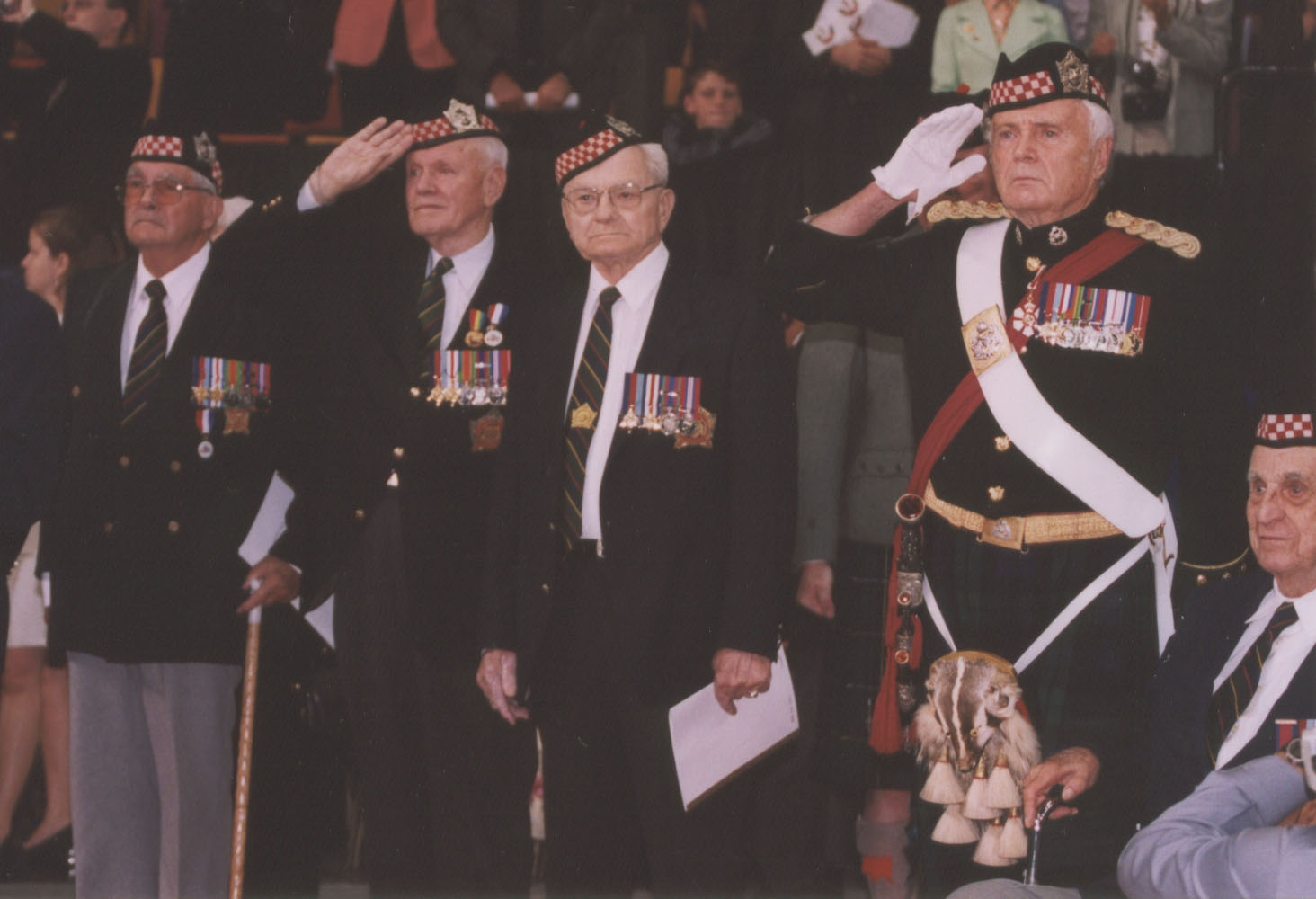 Col Alan Earp, OC, leads Argyll veterans in a salute at the Trooping of the Colours, 2002, at Copps Colisuem